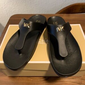 Michael Kors Lindsey thong sandals in size 8 color: Black Brand new in the box